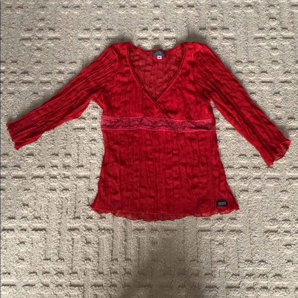 A sheer Versace v-neck with sequence detail